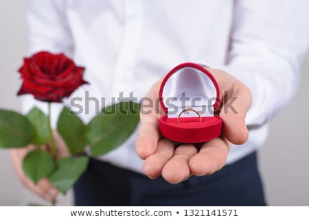 Stok fotoğraf: Man Giving Diamond Ring To Woman On Valentines Day