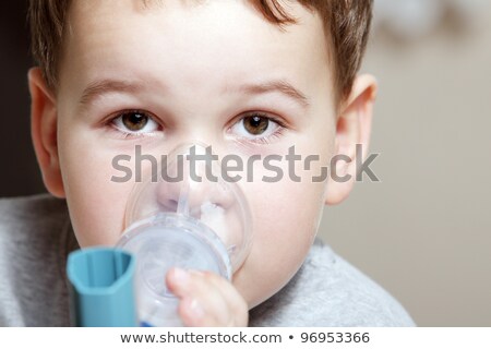 Stok fotoğraf: Close Up Image Little Boy Using Inhaler For Asthma