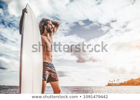 Foto d'archivio: Boy Holding Surf Board