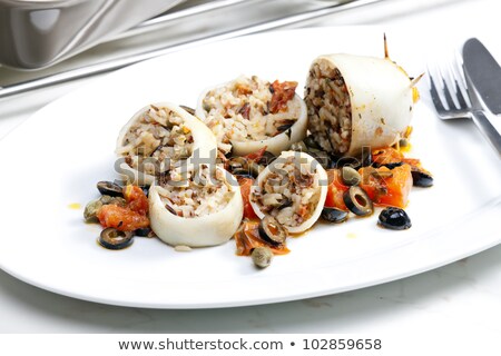 Foto d'archivio: Baked Sepia With Tomatoes And Black Olives Filled With Pearl Bar