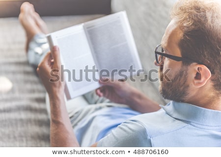 Stock foto: Young Man Reading A Book