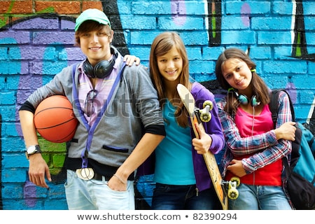 Stock photo: Group Of Friends About To Paint Wall
