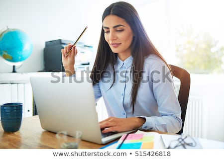 Stock fotó: Young Woman In Small Room Holding A Key