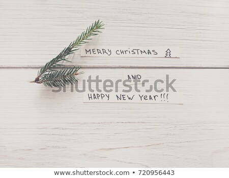 Foto d'archivio: Fir Branches On White Sheet Christmas Background For Congratula
