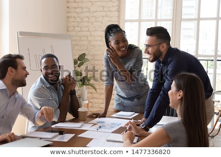 Stockfoto: Joyful Multiracial Business Team At Work In Modern Office