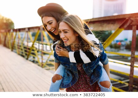 ストックフォト: Teenage Girls In Summer Clothes Hugging Outdoors