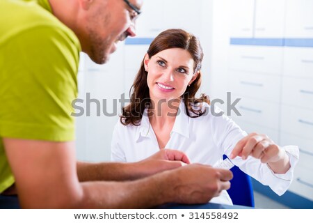 Stok fotoğraf: Receptionist Making Appointment