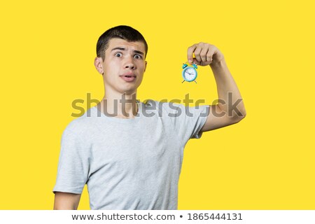 Stock photo: Man Stunned At Alarm Clock