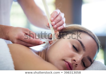 [[stock_photo]]: Man In Therapy With Ear Candles