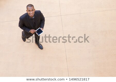 Stock fotó: Top View Of Man Looking At Tablet