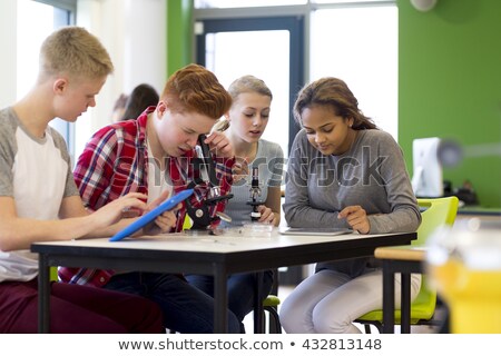 Stock fotó: Boy And Girl Looking At Plant Cell