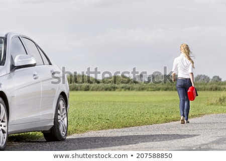 Сток-фото: Woman With Gas Can