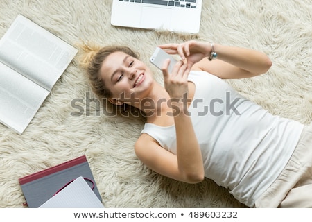 Stock fotó: Overhead View Of A Young Woman Using Her Laptop While Lying On The Beach