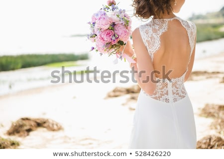 Stockfoto: Young Beautiful Woman In Wedding Dress On Beach