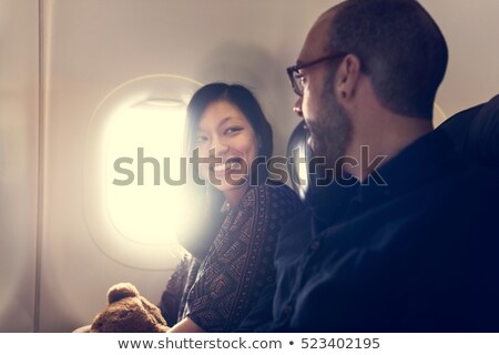 Stock photo: Happy Passengers Talking In Plane