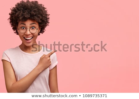 Foto stock: Portrait Of A Delighted Woman With Dark Curly Hair