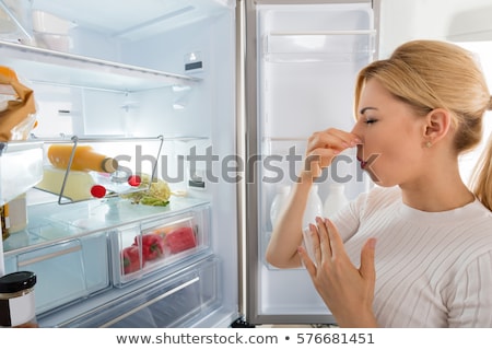 Stock foto: Woman Recognizing Bad Smell From The Refrigerator