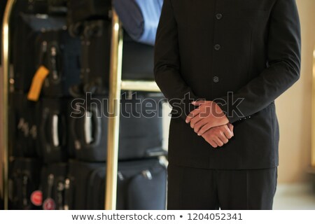 Stockfoto: Crop Hotel Worker With Luggage Cart