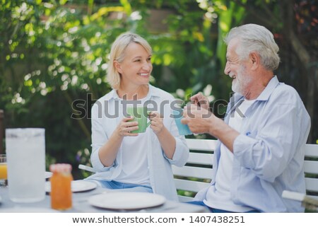 Stock photo: Couple At Picnic Table