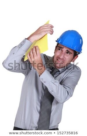 Zdjęcia stock: Engineer Shielding Himself From A Blow