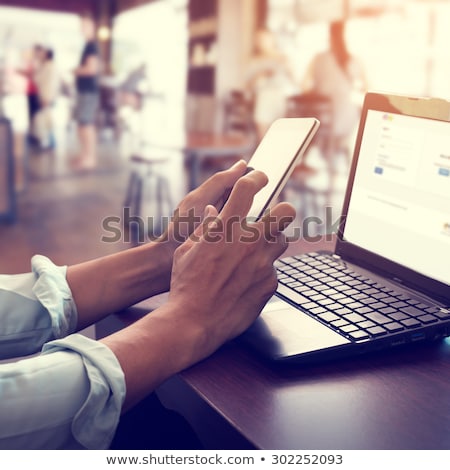 Foto stock: Mobile Phone On Table With Coffee On Side