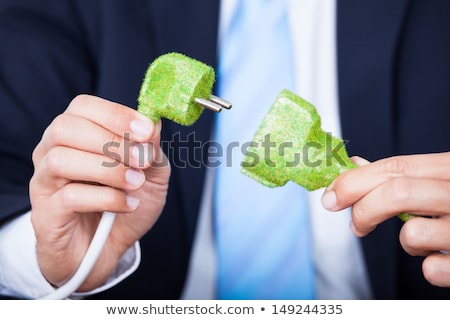 Stock fotó: Man Holding Grass Covered Cable