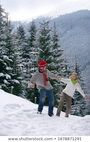 Foto stock: Two Girls In Snow On Hillside