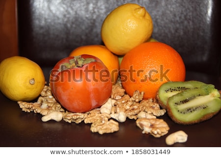 Foto stock: Green And Orange Pumpkin Persimmons Ingredients Decorations