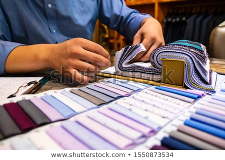 Foto stock: Tailor And Customer Choosing Material For Shirt