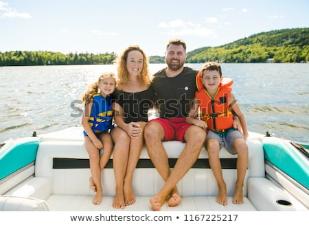 Foto stock: Family Out Boating Together Having Fun On Vacancy