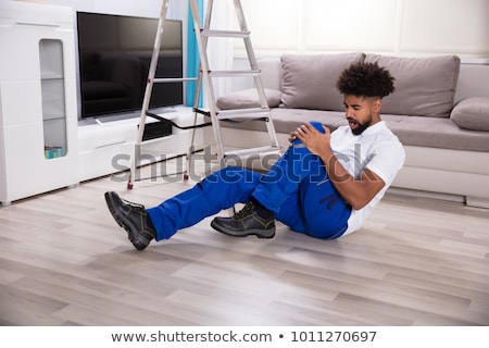 Stock photo: Male Mover Falling From Ladder