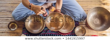 Stok fotoğraf: Nepal Buddha Copper Singing Bowl At Spa Salon Young Beautiful Woman Doing Massage Therapy Singing B