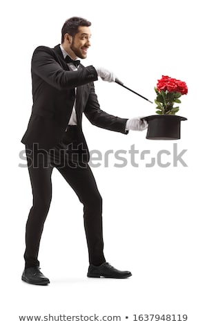 Stockfoto: Young Magician Performing Red Rose