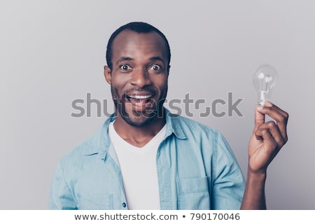 Zdjęcia stock: Surprised Man Holding Lighting Bulb