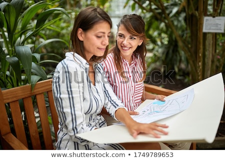 Stok fotoğraf: Female Architect Watching A Paper