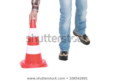 ストックフォト: Setting Down A Traffic Pylon