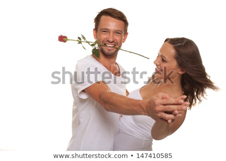 Foto stock: Red Rose Between People In Love