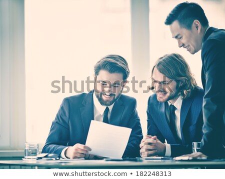 Joyeux trois jeunes hommes d'affaires [[stock_photo]] © Pressmaster