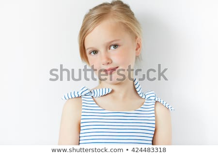 Stock fotó: Portrait Of A Cheerful Young Curly Blonde Girl In Dress