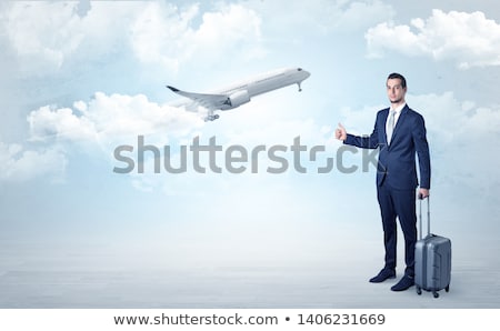 Stock photo: Agent Hitchhiking With Departing Plane Concept