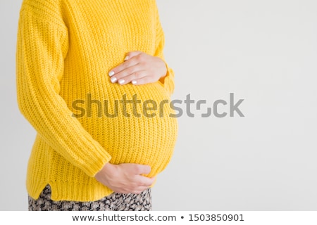 Stok fotoğraf: Pregnant Woman With Knitted Jumper