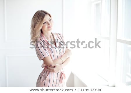 Foto stock: Happy Beautiful Woman Staring Out The Window