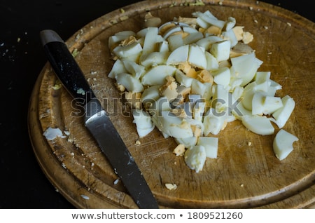 Stok fotoğraf: Kitchen Board With Finely Chopped Eggs