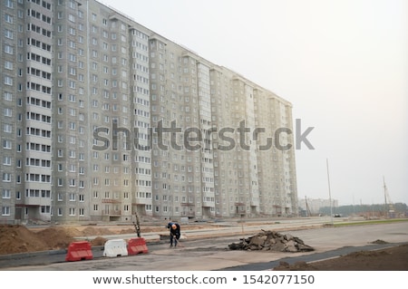 Foto stock: Builder Strong Worker In Protective Helmet Serious Powerful Se