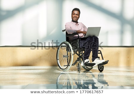Stok fotoğraf: African Businessman In Wheelchair With Laptop