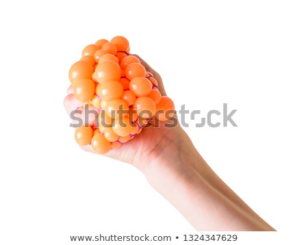 Foto stock: Hands Squeezing Ball Toy