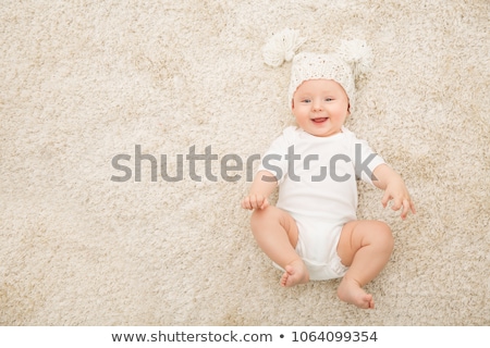 Stock fotó: Happy Baby Lying On The Back On A Blanket