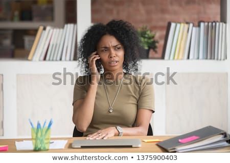 Stockfoto: Angry Woman Talking On The Phone