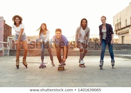 Stock photo: Boy Riding Roller Skates On The Street