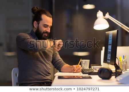 Stock foto: Man With Smartwatch Using Voice Recorder At Office